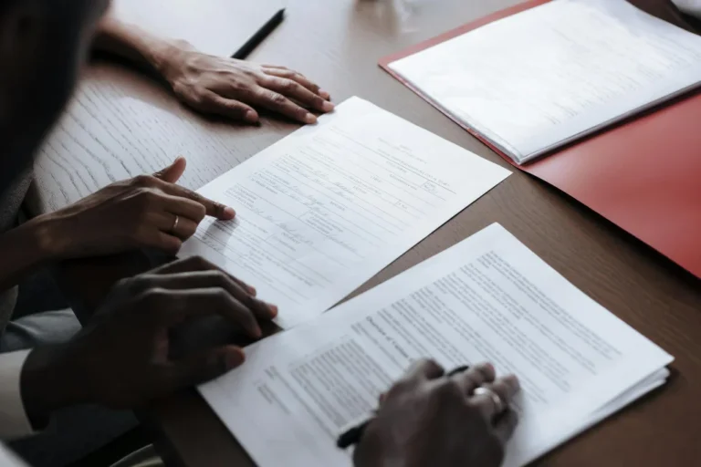 Property sale documents being reviewed during a legal process in Kenya