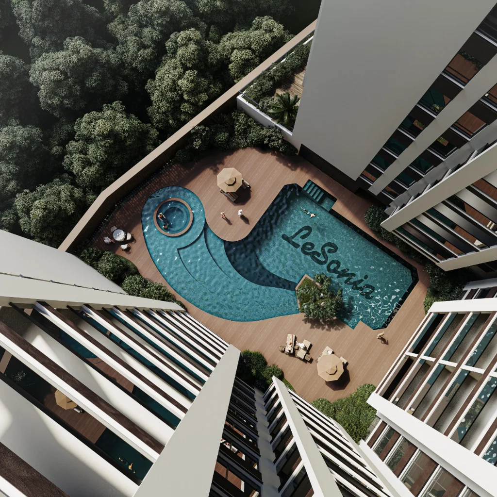 Bird's-eye aerial view of Lesonia Residency Kileleshwa freeform swimming pool with jacuzzi, timber deck and lush tropical landscaping between building wings