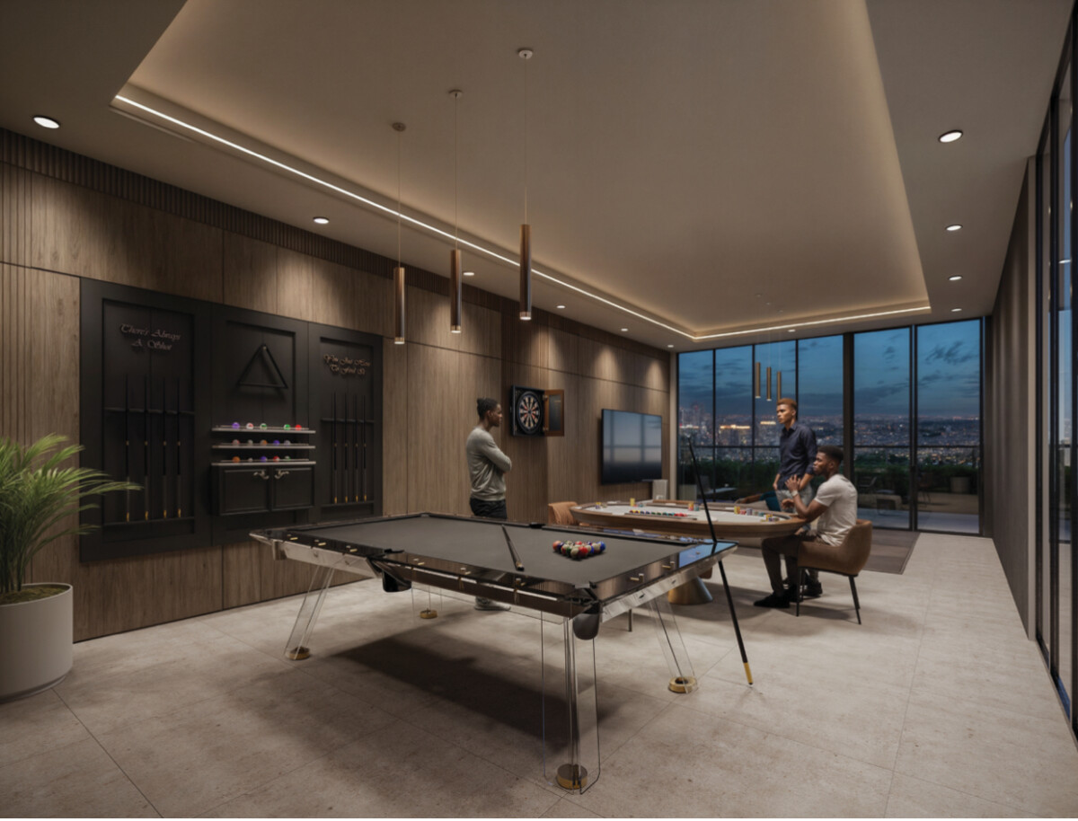 "Games and recreation room at Montbleu Westlands with pool table, dart board, bar setup, comfortable seating, pendant lighting, and panoramic city views"