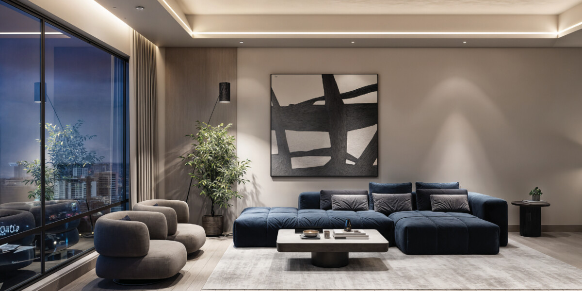 "Sophisticated living room at Montbleu Westlands with blue sectional sofa, sculptural chairs, minimalist artwork, floor-to-ceiling windows, and contemporary furnishings"